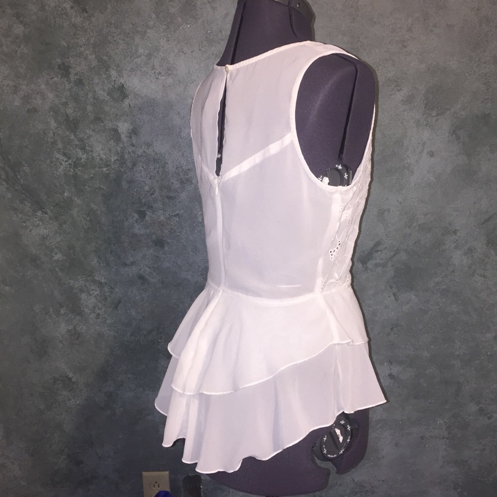 White sleeveless peplum top